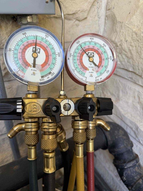 Completed comprehensive maintenance agreement inspection on two air conditioning systems. Performed full system evaluation including condenser coil inspection for cleanliness and leaks, blower motor and wheel debris check, indoor relative humidity testing, and refrigerant level measurement using manifold gauges. Cycled and visually inspected all operating controls, line voltage switches, and wiring for proper operation and safety compliance. Examined electrical connections for tightness and deterioration, inspected condensate drainage system for proper function, and checked refrigerant lines for visible leaks and insulation condition. Noted significant dust and debris accumulation on return air grille fins requiring attention. All safety and performance parameters evaluated per maintenance agreement protocol.