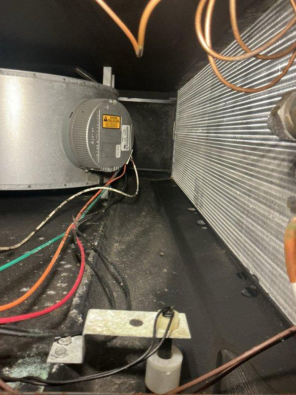 Completed comprehensive HVAC maintenance agreement service on air conditioning and air handler system. Performed system inspection, documented interior components including blower motor assembly and evaporator coil condition, and verified supply air temperature reading of 45°F at register. Filter replacement not included per agreement terms.