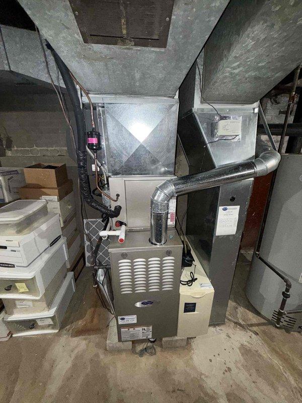 Completed comprehensive cooling maintenance on residential air conditioning system under service agreement plan. Performed thorough inspection of furnace and air handler assembly in basement mechanical room, including blower wheel cleaning to remove accumulated dust and debris from fan cage and interior components. System operational and ready for continued service.