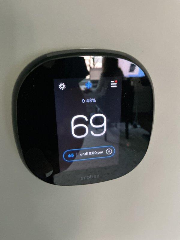 Performed preventative maintenance agreement inspection on four condenser units. Verified thermostat operation with ecobee smart thermostat displaying proper temperature control at 69°F setpoint and humidity reading of 48%. Inspected and documented air filtration system with pleated media filter in place showing adequate condition for continued operation.