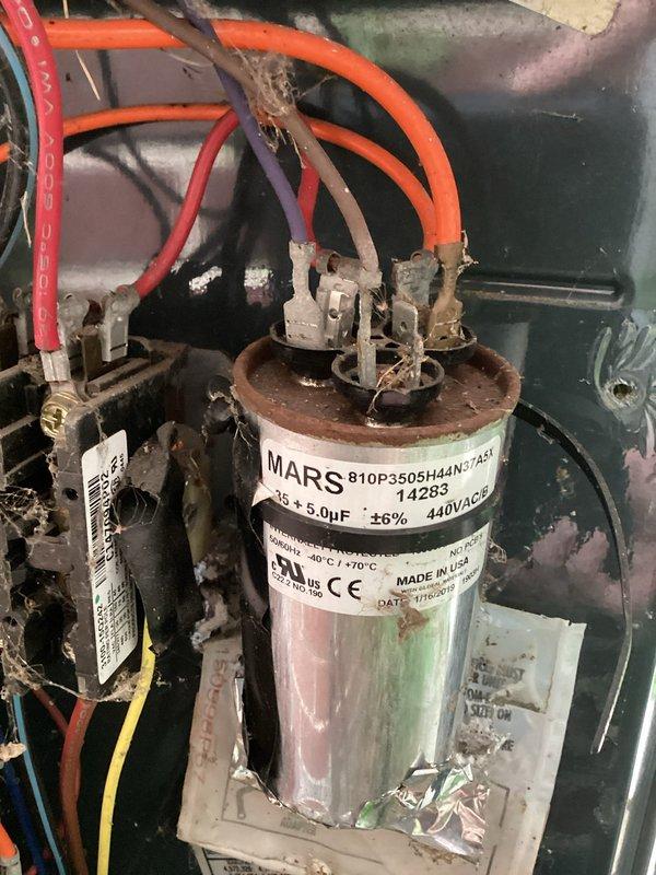 Completed preventive maintenance agreement service on two air conditioning systems. Performed comprehensive cooling checks including thermostat operation verification, electrical component inspection, and capacitor assessment. Documented existing capacitor showing signs of corrosion requiring future attention, while newer replacement capacitor in adjacent unit operating within normal parameters at proper voltage and microfarad ratings.