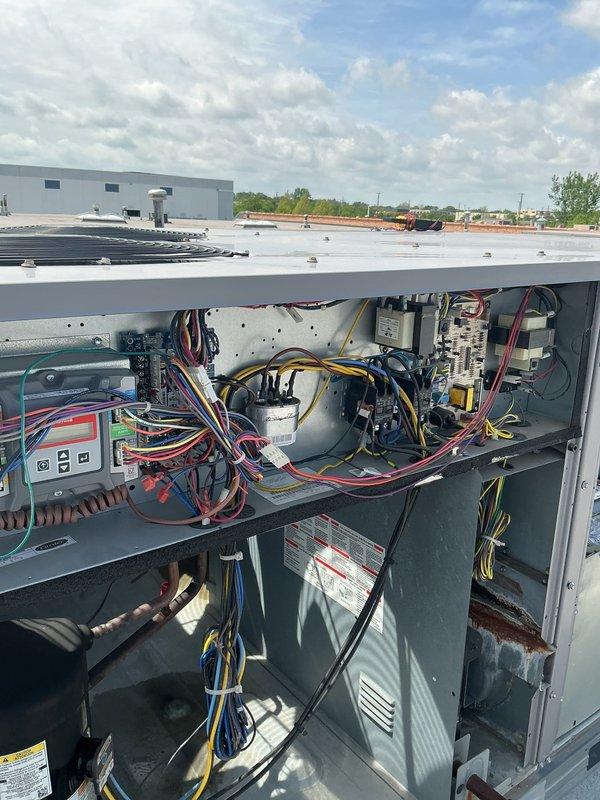 # HVAC Maintenance - Agreement Service Completed

Performed preventive maintenance on a commercial rooftop unit (RTU) requiring a 32-foot ladder for roof access. Accessed both electrical and blower compartments to conduct comprehensive inspection and servicing. Replaced two 16x25x2 filters to maintain proper airflow and system efficiency. Inspected electrical components including control board, capacitors, relays, and wiring harnesses, confirming all connections were secure and operational. Examined blower assembly and verified proper operation. All components found in good working condition with normal wear patterns for outdoor installation. System operational upon completion of maintenance agreement service.