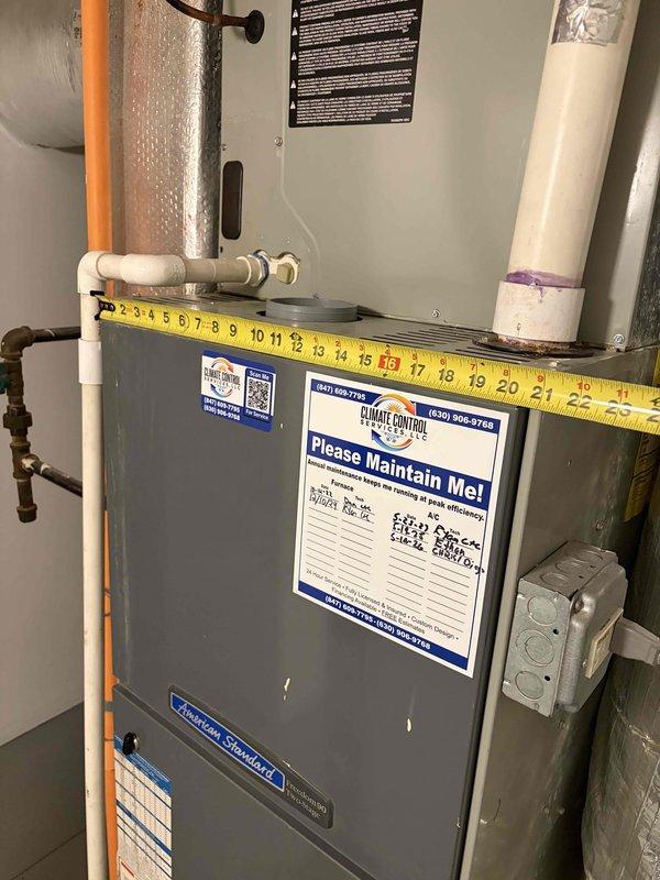 Conducted comprehensive HVAC estimate for complete air conditioning system replacement on residential property with existing 20+ year old unit that has reached end of service life. Evaluated current American Standard furnace and air handler installation in basement mechanical room, documented existing ductwork configuration including flexible insulated ducts and reflective insulation, assessed copper refrigerant line routing and PVC condensate drainage system, photographed equipment dimensions and clearances for proper replacement unit sizing, and verified gas line connections and venting arrangements to ensure compatibility with new system specifications.