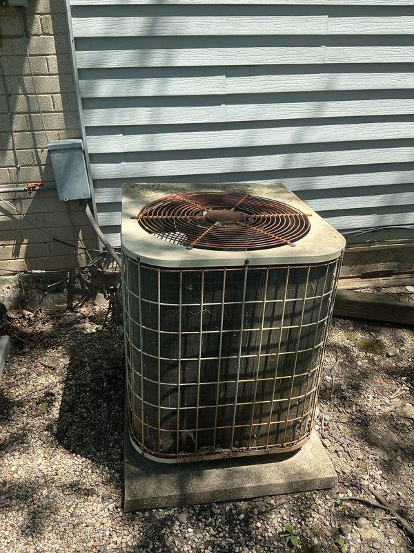 Completed preventative maintenance agreement inspection on two residential air conditioning systems. Performed comprehensive system evaluation including visual inspection of outdoor condenser units, electrical disconnect boxes, and associated components. 

During inspection, discovered significant accumulation of organic debris and plant material inside one electrical disconnect enclosure, which posed potential safety hazard and could compromise electrical connections. Cleaned out debris from disconnect box to ensure proper electrical operation and prevent moisture retention that could lead to component failure or electrical shorts. Verified all electrical connections were secure and functioning properly after cleaning.

Inspected both condenser units for proper operation, checking fan blade condition, housing integrity, and overall system performance. Noted weathering and age-related wear on equipment exteriors consistent with outdoor exposure. Verified units were properly positioned 