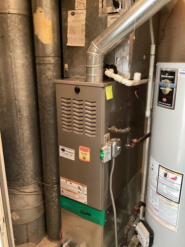 Completed preventive maintenance inspection on residential HVAC system including Lennox furnace unit and associated ductwork components. Performed visual inspection of equipment, verified proper operation of all mechanical systems, and documented current condition of furnace, ductwork, water heater connections, and related plumbing components with photographic evidence for maintenance records.