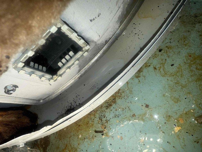 Responded to emergency call for tanked water heater failure resulting in complete loss of hot water. Upon arrival, found water heater in severely deteriorated condition with extensive water damage to surrounding floor area and visible corrosion staining throughout the installation space. Unit exhibited signs of catastrophic failure with significant moisture intrusion and long-term neglect. Documented existing conditions through photographic evidence showing rust-colored staining patterns on floor surface, damaged equipment housing, and compromised internal components. Assessed water heater system and confirmed unit was beyond repair, requiring full replacement. Provided customer with emergency service during evening hours to address immediate hot water restoration needs.