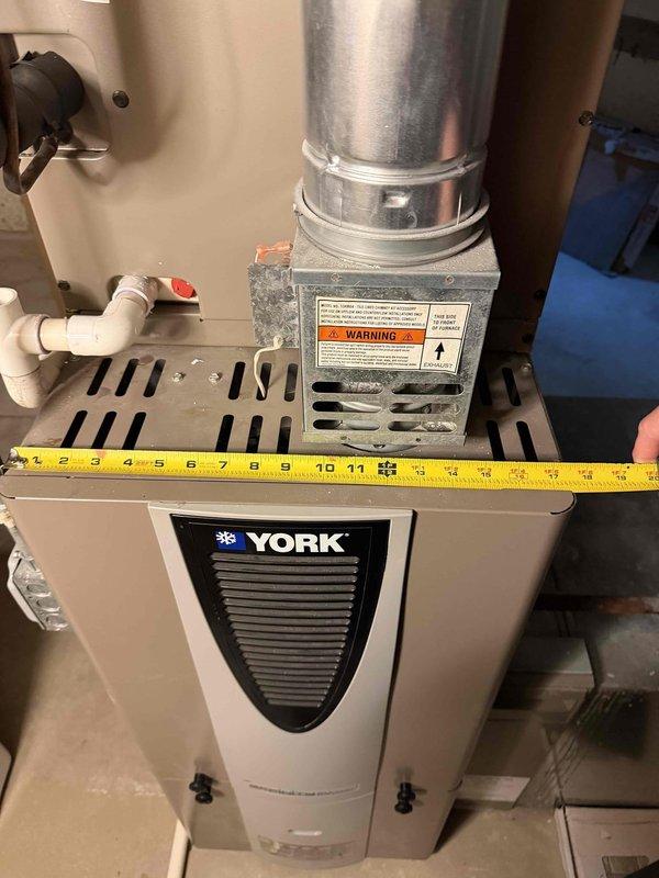 Conducted comprehensive HVAC estimate for replacement of 18-year-old residential air conditioning system. Evaluated existing York brand furnace and air handler configuration in basement utility room, documenting current ductwork connections, refrigerant lines, electrical components, and condensate drainage system. Photographed equipment dimensions and existing infrastructure to determine replacement unit specifications and installation requirements for complete system upgrade.