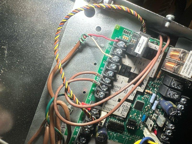 Responded to callback for air conditioning system not cooling following previous service visit. Upon arrival, discovered control board displaying F88 fault code indicating communication error between main control board and secondary circuit board. Inspected dual PCB assembly and identified failed relay on primary control board preventing proper signal transmission to compressor contactor. Replaced defective relay, cleared fault code, and verified all wire connections between boards were secure. Cycled system through complete cooling operation and confirmed proper communication between control boards, compressor engagement, and normal cooling function restored.