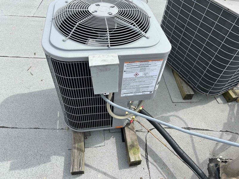 # HVAC Install - Complete System

Successfully completed full HVAC system replacement including furnace, condenser unit, evaporator coil, and thermostat. Installed new condenser on rooftop location with proper mounting on wooden platform for equipment stability and vibration isolation. Ran and secured refrigerant lines with appropriate insulation (suction and liquid lines) from outdoor unit to indoor coil. Connected electrical service and verified proper voltage supply to condenser. Installed new evaporator coil in air handler and ensured proper fitment and sealed connections to ductwork. Replaced furnace unit with new equipment, verifying gas connections, venting, and combustion air supply met code requirements. Installed new programmable thermostat and verified proper wiring and communication with HVAC equipment.

Performed system startup and commissioning procedures. Verified refrigerant charge using digital manifold gauges, measuring superheat and subcooling values to confirm prope