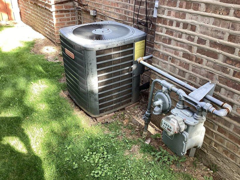 Performed routine AC maintenance on residential condensing unit. Inspected condenser coils, verified electrical connections at disconnect box, checked refrigerant lines, and replaced air filter. Unit operating within normal parameters upon completion.