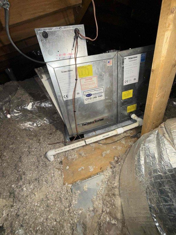 Completed comprehensive cooling system maintenance agreement inspection on residential split system. Performed thorough evaluation of outdoor condensing unit positioned on proper drainage pad with adequate clearance, verified electrical connections and disconnect functionality, and inspected indoor air handler unit located in attic space. Documented system condition with photographic records showing proper installation, confirmed all safety labels present, and noted equipment operating within normal parameters.
