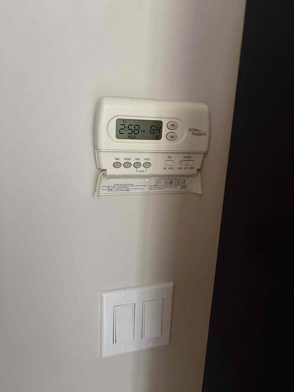 Evaluated 17-year-old residential HVAC system experiencing cooling failure due to defective evaporator coil. Documented existing equipment configuration including outdoor condensing units and indoor components. Provided comprehensive replacement estimate as customer is considering full system replacement versus coil repair given age of equipment.