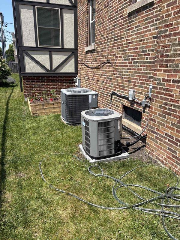Evaluated 17-year-old residential HVAC system experiencing cooling failure due to defective evaporator coil. Documented existing equipment configuration including outdoor condensing units and indoor components. Provided comprehensive replacement estimate as customer is considering full system replacement versus coil repair given age of equipment.