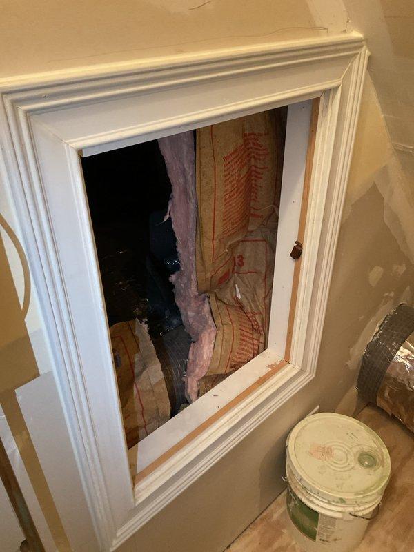 Responded to no cooling complaint and discovered leaking air duct penetrating ceiling with conditioned air escaping into wall cavity and attic space. Documented damaged flexible ductwork with compromised insulation wrap and noted access limitations requiring smaller technician for proper repair in confined attic area.