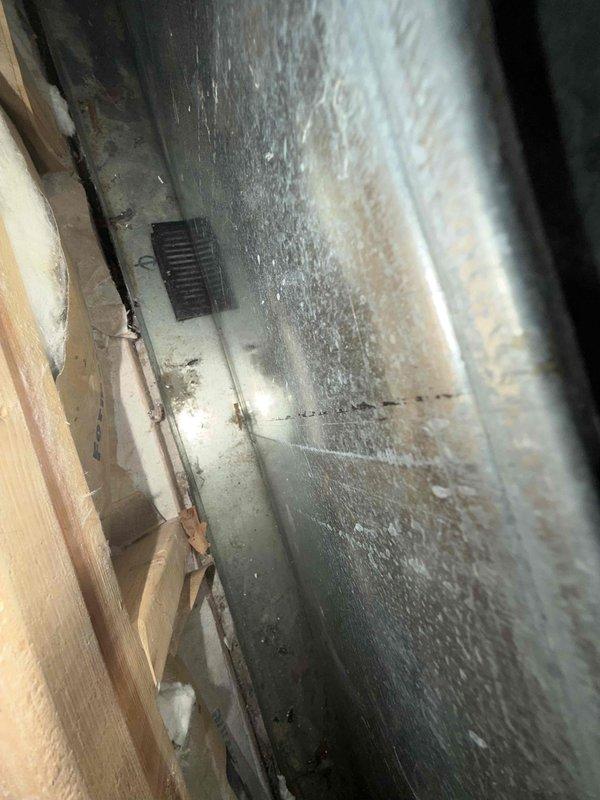 Performed maintenance inspection on air conditioning system and addressed clogged condensate drain line. Cleared obstruction from drain pipe to restore proper drainage function and prevent water damage. Verified system operation and condensate flow, with monitoring equipment showing normal status indicators upon completion.