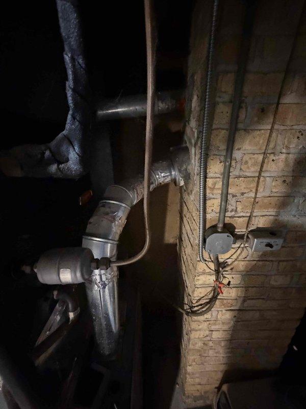 Provided comprehensive estimate for complete air conditioning system replacement for new customer. Evaluated existing outdoor condenser unit showing age and deterioration, surrounded by overgrown vegetation requiring clearance for proper airflow and service access. Assessed indoor HVAC components in basement mechanical room, including aged air handler, water heater connections, and existing ductwork infrastructure with visible signs of weathering and corrosion throughout piping system. Documented current equipment specifications, measured installation space requirements, and photographed both outdoor and indoor units to develop accurate replacement proposal. Recommended modern high-efficiency system to replace aging equipment, ensuring proper sizing for home's cooling load requirements and compliance with current building codes and manufacturer specifications.