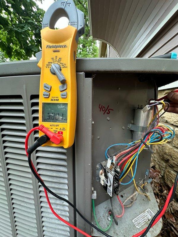 Completed comprehensive maintenance agreement service on two air conditioning units and one air handler. Performed thorough system inspections including electrical measurements, verified proper amperage draw at 38.8 amps on outdoor condenser unit, inspected capacitor and contactor assembly, examined blower wheel assembly and motor components, and documented all equipment conditions with photographic records. All systems operating within normal parameters upon completion of general service procedures.