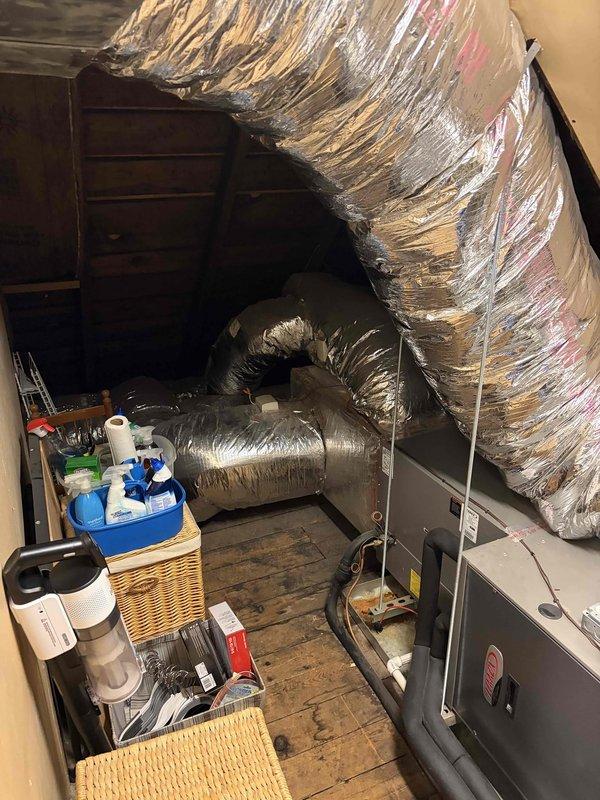 Conducted comprehensive evaluation of 12-year-old residential HVAC system consisting of fan coil and air conditioning unit located in easily accessible attic space. Assessed condition of existing Lennox equipment, including air handler, refrigerant lines, electrical connections, ductwork, and control components to provide detailed replacement estimate. Documented system configuration, component locations, and installation accessibility with photographic evidence showing flexible ductwork, insulated refrigerant lines, electrical relay panels, and overall system layout for replacement planning purposes.