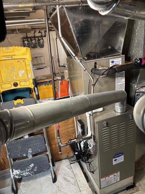 Performed complete HVAC system replacement including furnace, air conditioning unit, evaporator coil, thermostat, and condensate pump. All equipment was installed in residential mechanical room with proper leveling, connections, and code-compliant ductwork integration. System was tested and verified operational upon completion.