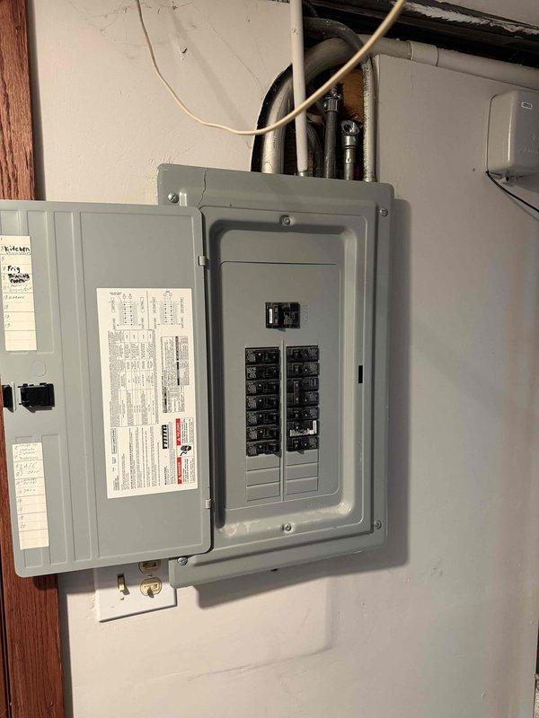 Completed comprehensive evaluation of aging HVAC system consisting of 16-year-old air conditioning unit and 20+ year-old furnace. Diagnosed refrigerant restriction in AC line/loop and documented equipment condition with photographs of electrical panels and outdoor condensing unit. Recommended full system replacement due to age of equipment and identified refrigerant system failure.