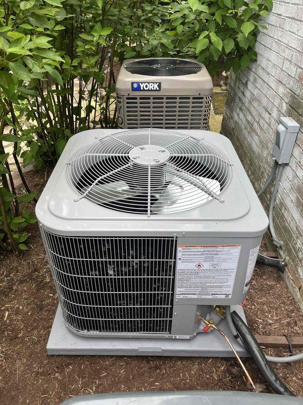 Successfully completed full air conditioning system replacement including outdoor condensing unit and indoor evaporator coil. Removed existing equipment and installed new AC unit on concrete pad with proper refrigerant line connections and electrical conduit. System commissioned and verified operating at 69°F supply air temperature, confirming proper cooling performance.