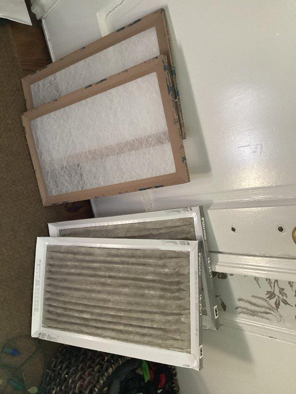 Completed cooling check on single air conditioning system. Inspected outdoor condensing unit, noting vegetation growth around base that may restrict airflow. Compared and evaluated air filters, identifying one with significant dust and dirt accumulation requiring replacement to maintain proper system efficiency and indoor air quality.