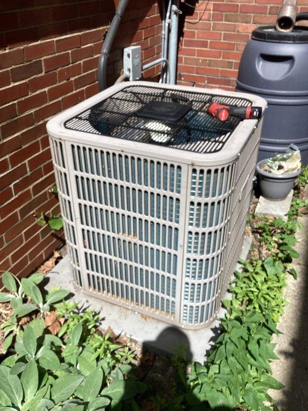 Completed cooling check on single air conditioning system. Inspected outdoor condensing unit, noting vegetation growth around base that may restrict airflow. Compared and evaluated air filters, identifying one with significant dust and dirt accumulation requiring replacement to maintain proper system efficiency and indoor air quality.