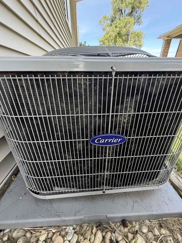 Completed preventive maintenance agreement service on Carrier brand outdoor condensing unit. Performed standard inspection of unit components including condenser coils, fan motor assembly, and electrical connections. Installed new 16x25x1 filter as specified in maintenance agreement. Unit found in good operating condition with no visible damage, proper airflow through grille panels, and clean exterior housing. Concrete pad stable with adequate clearance from structure. Documented equipment condition with photographs for service records.