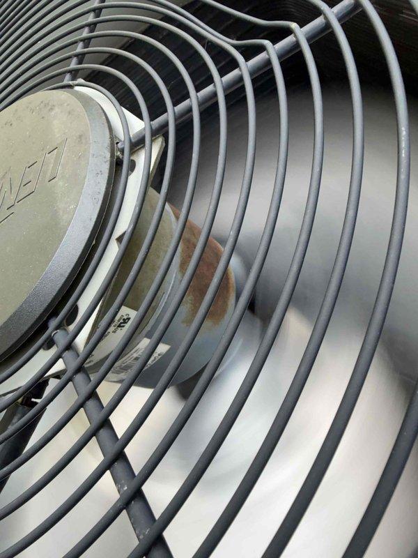 Completed comprehensive preventative maintenance inspection on air conditioning system per agreement specifications. Inspected condenser coil for cleanliness and leaks, verified blower motor and wheel condition, tested indoor relative humidity levels, and measured refrigerant charge. Cycled and inspected all operating controls for proper function. Examined line voltage switches, wiring connections, and electrical components for tight connections and signs of deterioration. Verified condensate drainage system operating correctly and inspected refrigerant lines for visible leaks and insulation integrity. Photographically documented condenser fan assembly with protective wire guard and motor housing, as well as electrical compartment showing capacitor, contactor, and wiring connections. All components found operational with normal wear patterns consistent with regular use. System operating within manufacturer specifications.