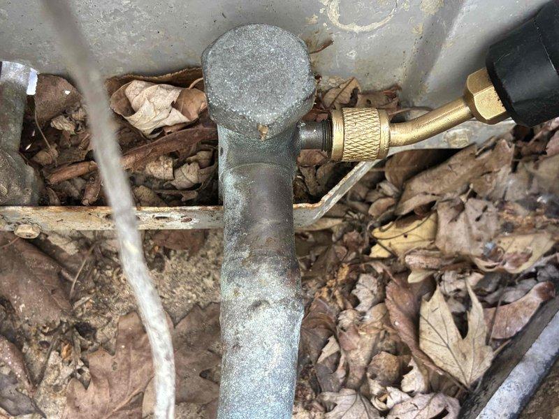 Responded to no cooling complaint on residential AC unit installed in June 2019. Upon inspection, found evaporator coil heavily contaminated with dust, debris, and organic material lodged between fins, severely restricting airflow and heat transfer capability. Cleaned evaporator coil thoroughly to restore proper airflow and system efficiency. Inspected exterior condensate drain connections and plumbing components, which showed normal weathering but remained functional. Verified unit is covered under 10-year parts warranty through Carrier and 10-year labor warranty contingent upon continued annual maintenance. System restored to proper cooling operation.