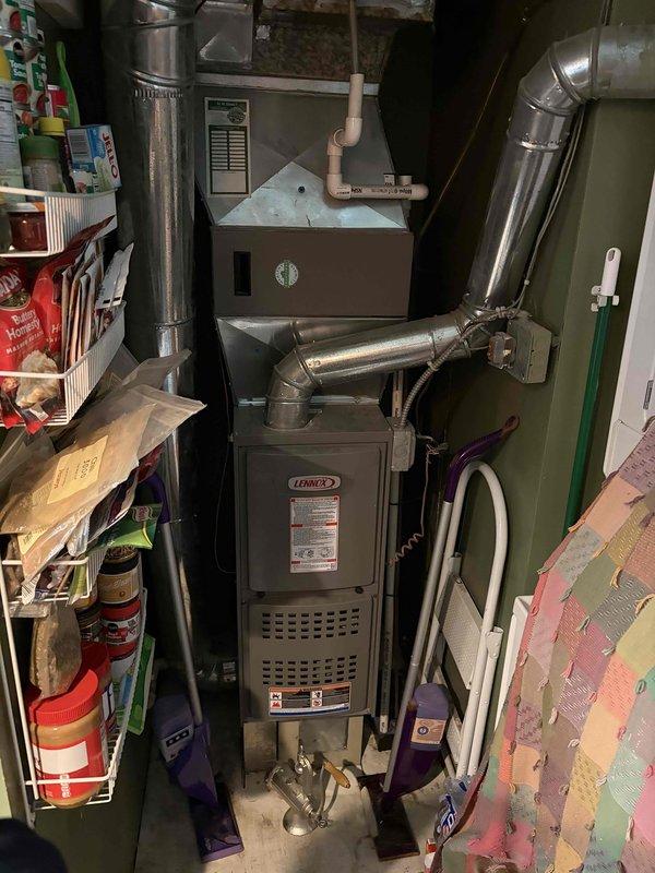 Provided estimate for complete HVAC system replacement including outdoor condensing unit and indoor furnace. Current 10-year-old air conditioning unit located in backyard between house and fence is low on refrigerant due to consistent leaks, making replacement more cost-effective than repair. Customer requested quote for relocating outdoor unit to improved location with better clearance from vegetation and structures. Assessed existing Lennox furnace system in basement and outdoor condensing unit positioned on concrete pad with inadequate clearance from overgrown vegetation. Recommended replacement of both outdoor and indoor equipment to ensure proper system matching, efficiency, and warranty coverage. Discussed optimal placement options for new condensing unit to provide adequate service clearance and airflow while addressing customer's relocation preference.