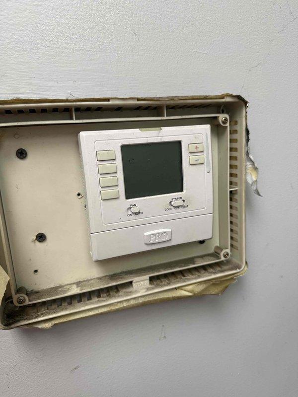 Responded to no-cool call for rooftop unit not powering on. Upon arrival, accessed RTU using 28' ladder and performed diagnostic testing with multimeter on electrical panels. Inspected wall-mounted PRO1 thermostat in protective enclosure and verified proper settings and wiring connections, documenting equipment condition with photos for service records.