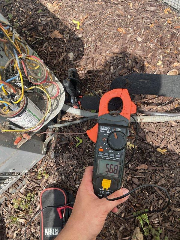 Responded to service call for newly installed AC unit not turning on. Upon arrival, performed electrical diagnostics using clamp meter at outdoor condenser unit. Measured current draw of 568 units and inspected line voltage wiring connections at service disconnect. Verified proper electrical supply to condenser, checked all wire terminations, and ensured unit received adequate power. System restored to operational status with compressor and condenser fan functioning properly.