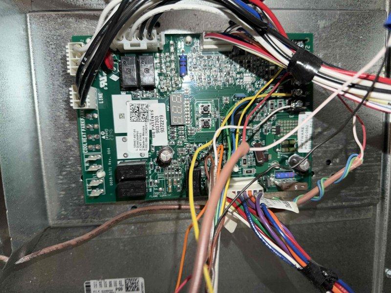 Responded to no-cooling complaint for upstairs air conditioning unit less than 5 years old. Accessed attic space via interior hallway to reach air handler and control system. Upon inspection of the control board assembly, diagnosed electronic control failure affecting system operation. Replaced defective control board with manufacturer-approved replacement unit, reconnected all electrical connections including power supply, communication wiring, and safety circuits. Verified proper voltage readings, tested all system functions, and confirmed unit returned to normal cooling operation.