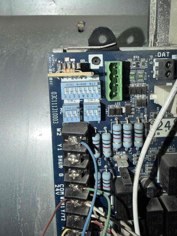 Completed preventative maintenance inspection on air conditioning system under maintenance agreement. Inspected refrigerant lines showing normal patina and oxidation consistent with system age, verified secure mounting and proper penetration through masonry foundation. Evaluated control board operation, confirmed all relays, communication terminals, and humidifier controls functioning properly with no signs of overheating or component failure.