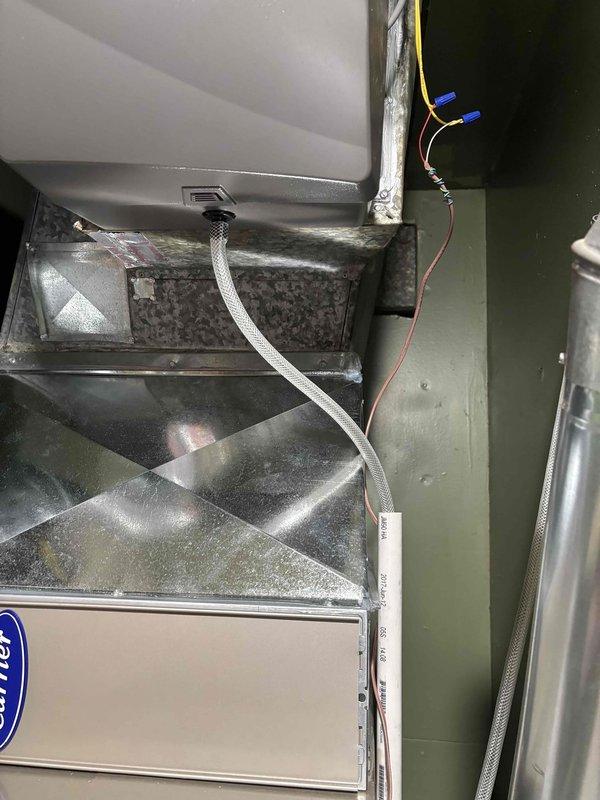 Completed full HVAC system replacement including Carrier furnace, air conditioning unit, evaporator coil, and humidifier. Two-person crew successfully removed existing equipment and installed all new components in a single day. All ductwork connections were properly sealed and secured, electrical wiring completed to manufacturer specifications, and humidifier integrated with new furnace system. System tested and verified operational upon completion.