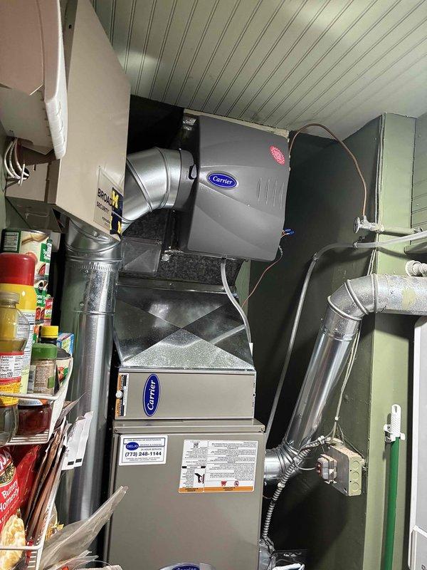 Completed full HVAC system replacement including Carrier furnace, air conditioning unit, evaporator coil, and humidifier. Two-person crew successfully removed existing equipment and installed all new components in a single day. All ductwork connections were properly sealed and secured, electrical wiring completed to manufacturer specifications, and humidifier integrated with new furnace system. System tested and verified operational upon completion.