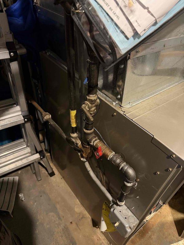 Responded to gas odor call back following utility company shutoff. Performed comprehensive inspection of HVAC system gas connections and piping in mechanical room. Checked all gas line connections, valves, and fittings for leaks using approved detection methods. Verified proper installation of gas supply lines to furnace unit, inspected yellow brass valve connections and copper piping runs. Confirmed all connections were secure and properly sealed. Coordinated with gas utility for system re-pressurization and final clearance to restore service.