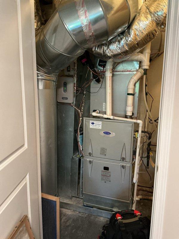 Completed routine HVAC maintenance agreement service on Carrier furnace system and condenser unit. Installed new 20x25x1 air filter, inspected ecobee thermostat operation confirming proper functionality at 72°F setpoint with hold mode engaged at 65°F, and verified all mechanical components, ductwork connections, and electrical controls within the utility closet are operating within normal parameters.
