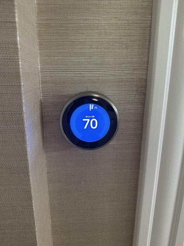 Returned to property to install and configure new wireless transmitter for master bedroom thermostat as part of zoning system upgrade. Successfully mounted transmitter module with antenna, established wireless communication with control board, and verified thermostat display showing proper temperature reading and system response.