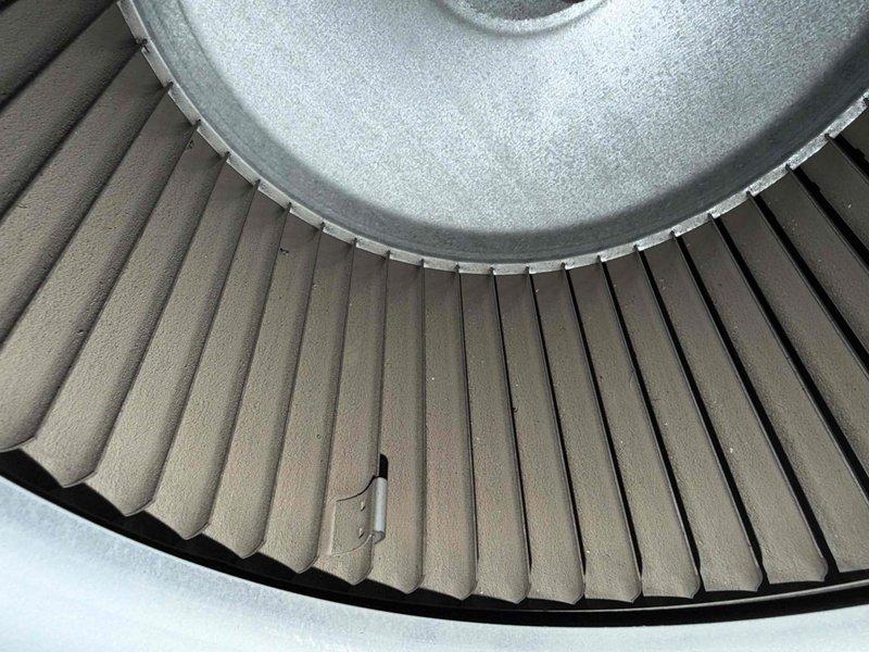 Completed cooling check on air conditioning system under maintenance agreement. Inspected blower wheel assembly, which showed normal dust accumulation consistent with operational use, and verified proper blade condition. Measured supply air temperature at 63°F, confirming adequate cooling performance and system functionality within normal operating parameters.