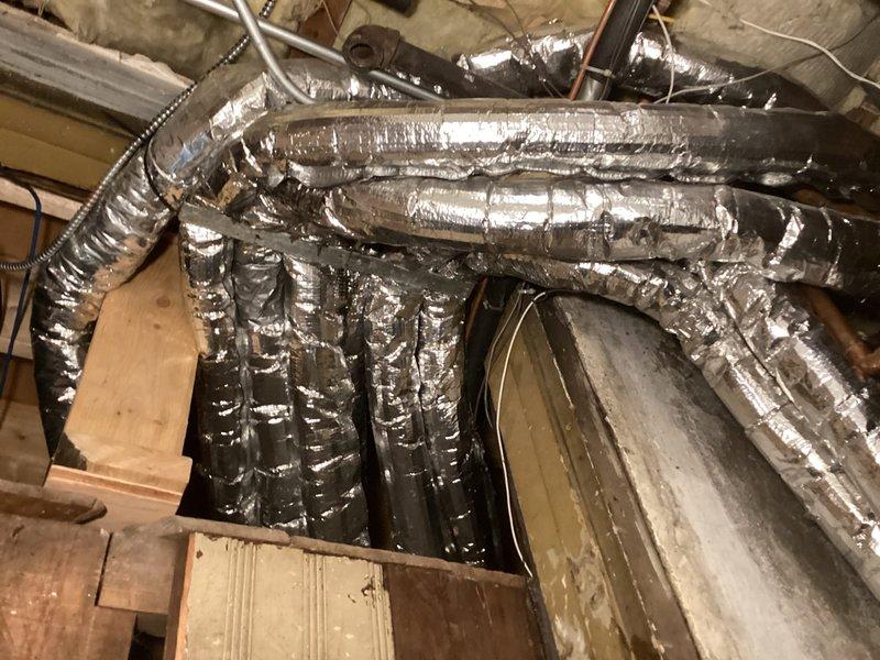 Responded to service call for non-operational dehumidifier system. Performed diagnostic inspection of the humidification equipment and associated ductwork installation. Inspected GeneralAire filter assembly and flexible ductwork routing throughout the mechanical space. Documented system conditions with photographic evidence showing filter location, duct configuration, and installation environment. Discussed coverage options for humidification equipment service with customer.