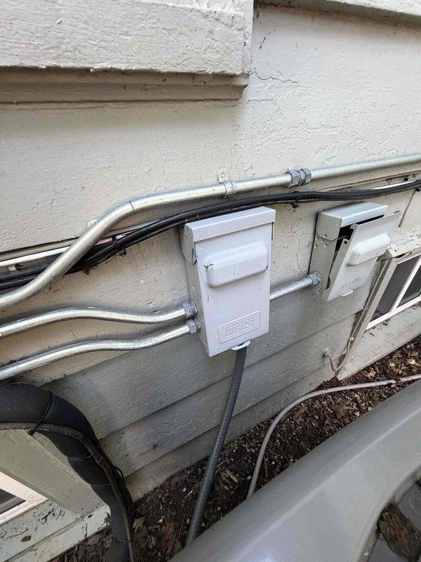 Responded to no cooling complaint on residential air conditioning system. Condenser unit failed to operate following reported power surge event. Performed diagnostic inspection of outdoor unit, electrical connections, and control components. Documented equipment condition and utility connections via photographs for service records.
