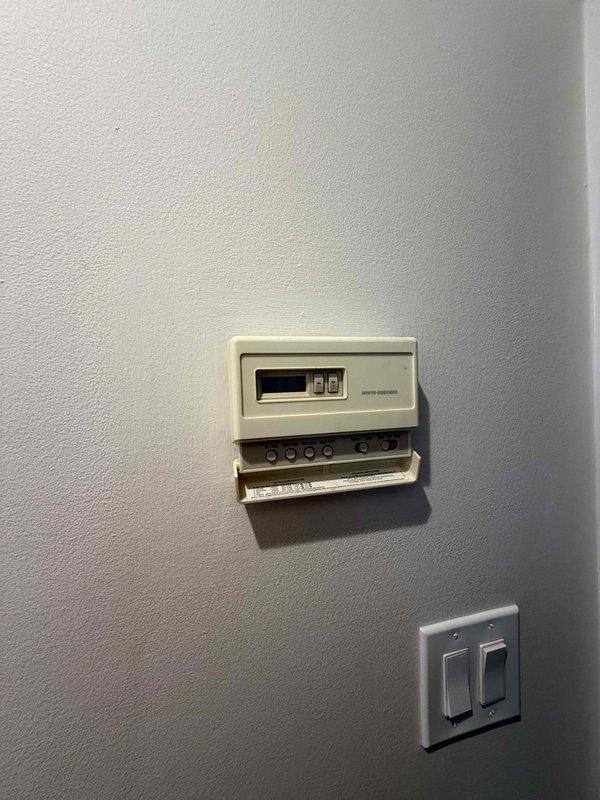 Responded to no cooling complaint on residential air conditioning system. Condenser unit failed to operate following reported power surge event. Performed diagnostic inspection of outdoor unit, electrical connections, and control components. Documented equipment condition and utility connections via photographs for service records.