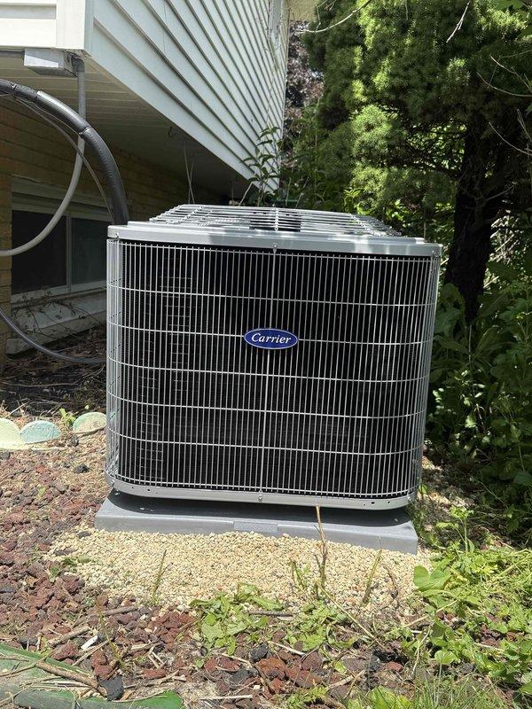Removed existing Bosch air conditioning system and installed new Carrier single-stage condensing unit on concrete pad with proper refrigerant lines and electrical connections. Unit tested and verified operational with all components functioning within manufacturer specifications.