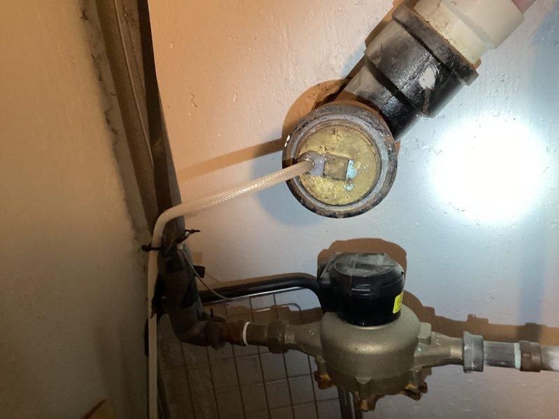 Completed preventive maintenance on condenser unit and replaced 20x25x1 air filter per maintenance agreement terms. Inspected water heater, plumbing connections, and associated mechanical equipment in utility room, documenting existing conditions including aged water meters with visible corrosion on metal components and PVC piping connections. All systems operational upon completion of service visit.