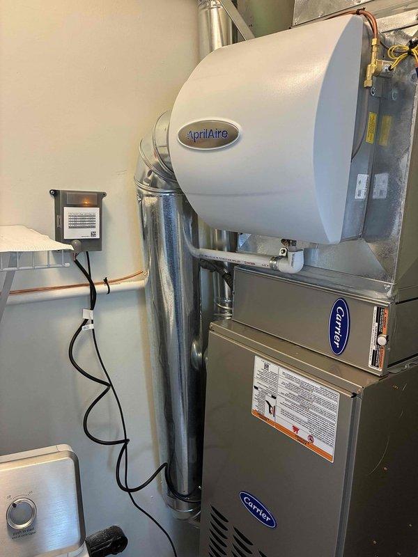 Completed replacement of outdoor condensing unit and indoor evaporator coil for residential air conditioning system. Two-person crew successfully removed existing equipment and installed new Carrier-compatible components, ensuring proper refrigerant line connections, electrical hookups, and drainage provisions. System tested and verified operational upon completion.