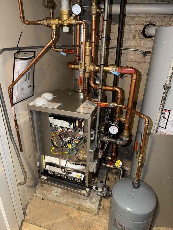 Responded to callback for thermostat communication failure on recently installed heating system. Upon arrival, accessed boiler control board and inspected wiring connections between thermostat and Resideo control module. Verified proper wire terminations, checked for loose connections in multi-conductor harness, and tested communication signals. Documented system configuration and control board diagnostic codes to ensure proper operation. System tested successfully with thermostat responding appropriately to commands.