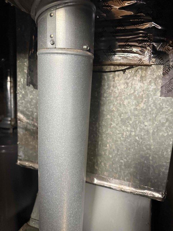 Completed estimate for furnace change-out replacement in attic space. Assessed existing ductwork connections, measured supply plenum dimensions, and documented current system configuration including metal supply duct and insulated flex duct connections to prepare comprehensive replacement proposal.
