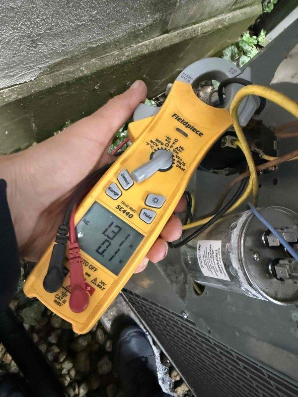 Completed comprehensive HVAC maintenance agreement service on multi-unit system including 5 air conditioning units, 2 air handlers, 1 electronic air cleaner, and replaced filters as specified in agreement. Performed diagnostic testing with clamp meter showing 13.72 amp draw on condensing unit, inspected and cleaned mesh filters showing moderate dust accumulation, and evaluated all accessible equipment including relocated third-floor unit behind closet. Noted active ceiling leak requiring follow-up repair and documented system conditions with photos for service records.